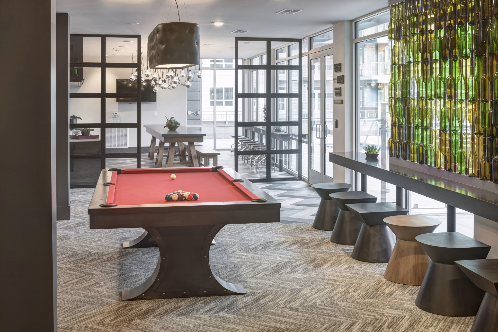 Elegant clubhouse featuring cozy seating areas at Alexan West Highland luxury apartments