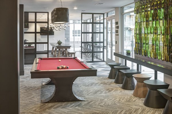 Elegant clubhouse featuring cozy seating areas at Alexan West Highland luxury apartments