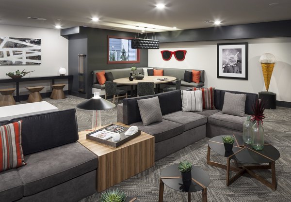 Modern clubhouse with stylish interiors at Alexan West Highland, luxury apartments by Greystar in Highland neighborhood