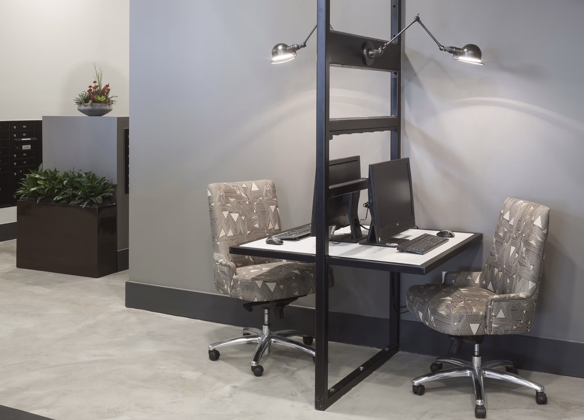 Modern business center featuring co-working spaces at Alexan West Highland luxury apartments