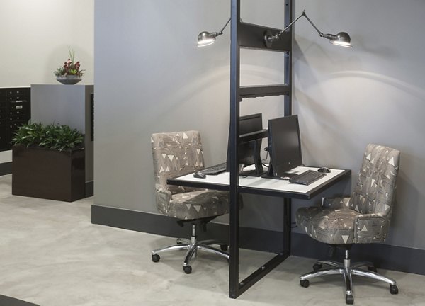 Modern business center featuring co-working spaces at Alexan West Highland luxury apartments