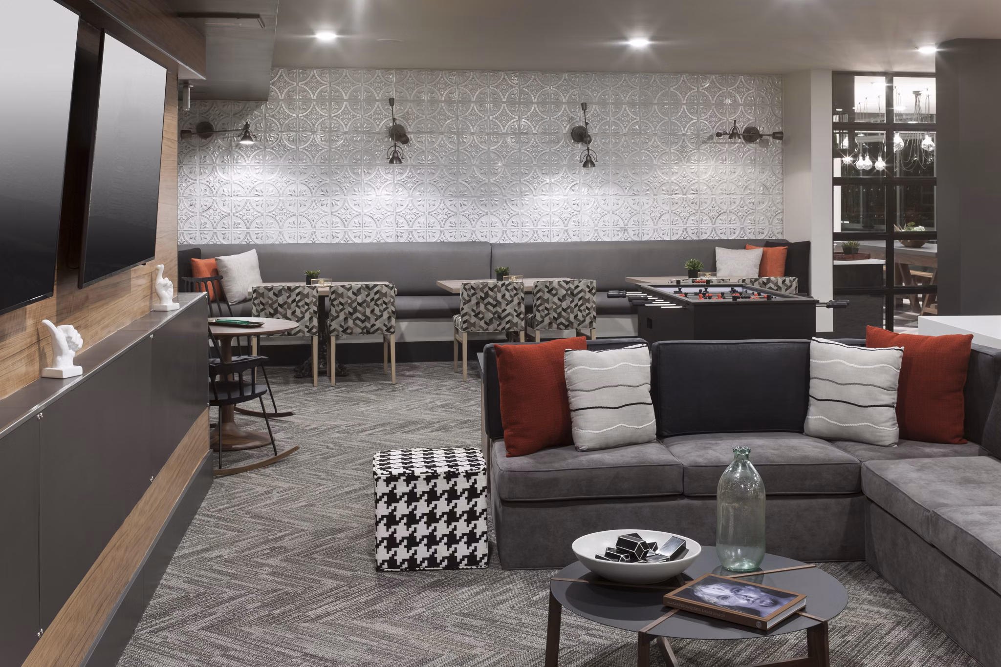 Clubhouse featuring modern design and luxurious amenities at Alexan West Highland apartments