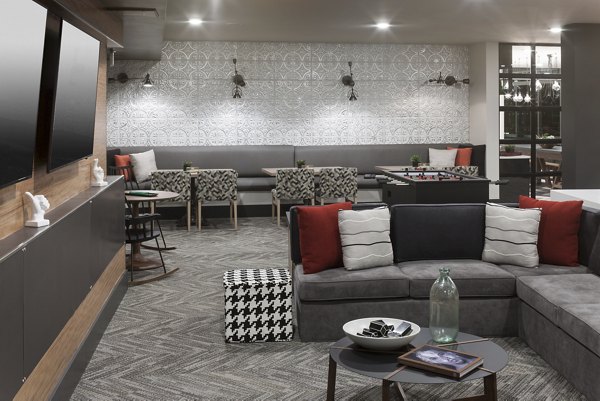 Clubhouse featuring modern design and luxurious amenities at Alexan West Highland apartments