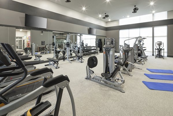 State-of-the-art fitness center featuring modern equipment at Alexan West Highland