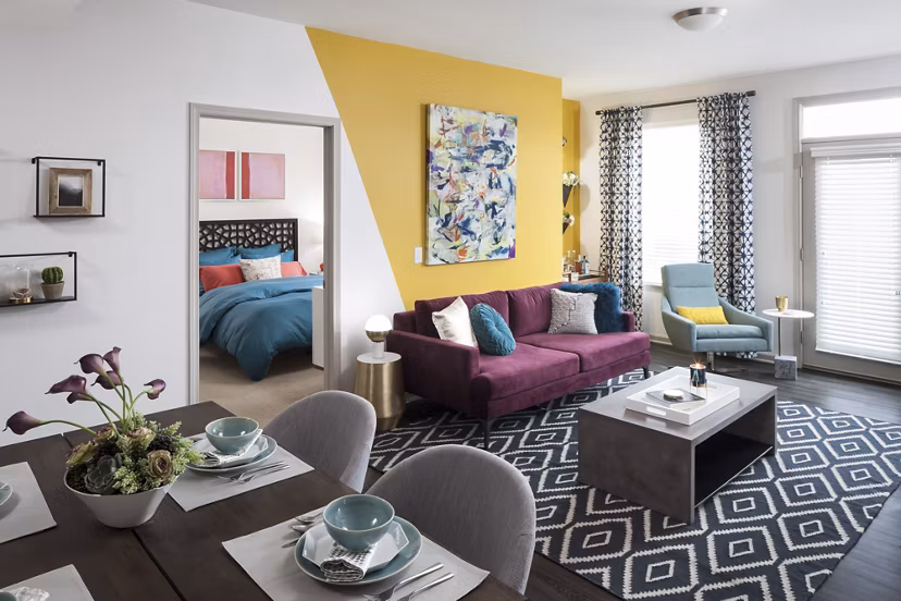 Cozy living room with modern decor at Alexan West Highland luxury apartments