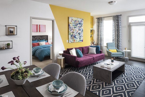 Cozy living room with modern decor at Alexan West Highland luxury apartments