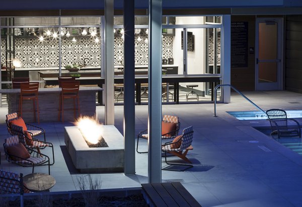 Chic patio with modern outdoor furniture at Alexan West Highland apartments