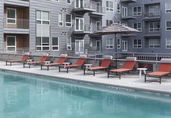 Serene poolside retreat at Alexan West Highland luxury apartments, ideal for relaxation and social gatherings