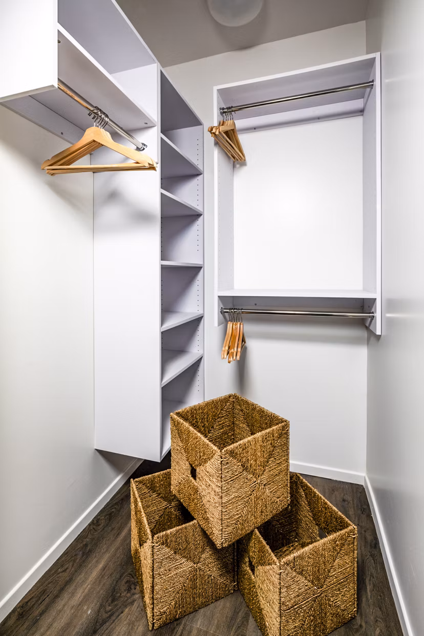 Walk-in bedroom closet with ample shelving at Burano Place Apartments