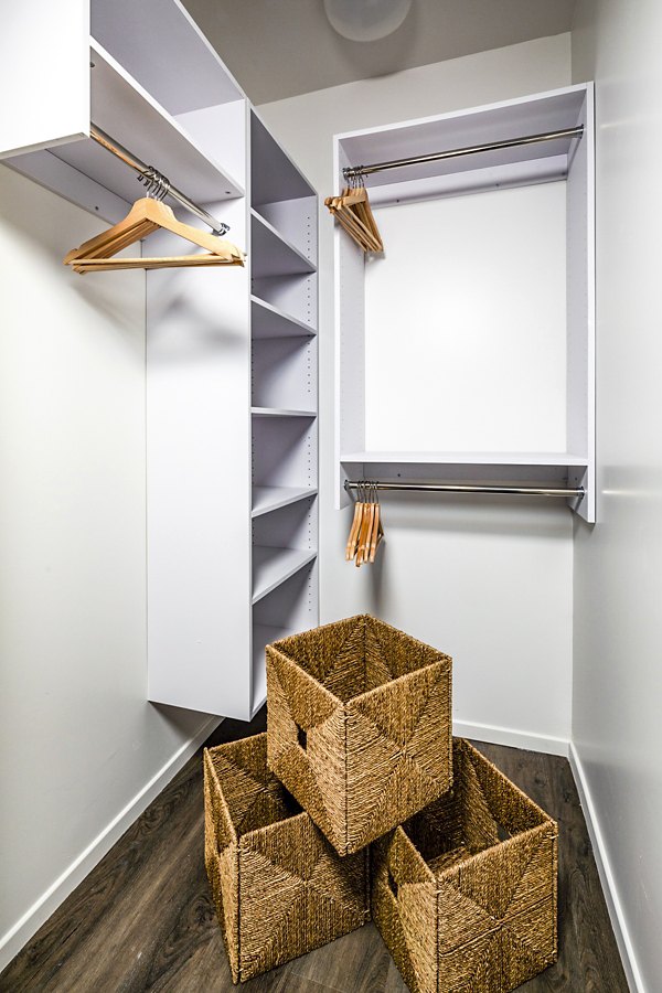 Walk-in bedroom closet with ample shelving at Burano Place Apartments