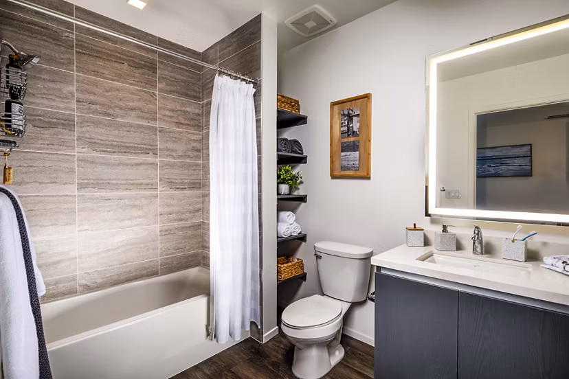 Bathroom with elegant marble countertops and modern fixtures in Burano Apartments