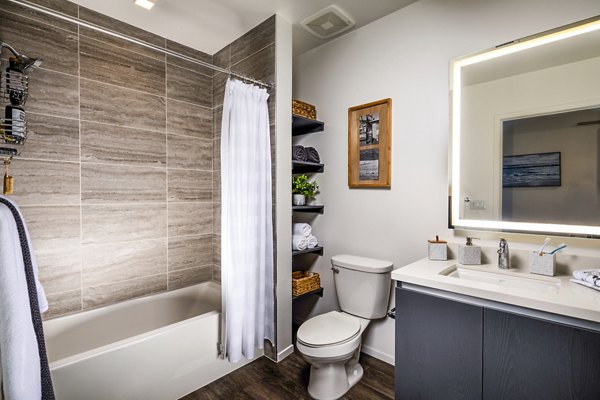 Bathroom with elegant marble countertops and modern fixtures in Burano Apartments