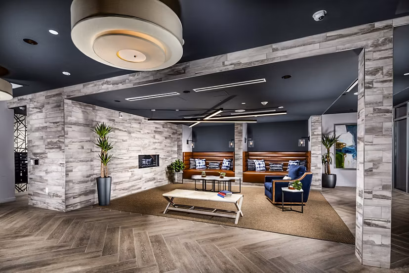 Clubhouse lounge with modern decor and seating area in Burano Apartments