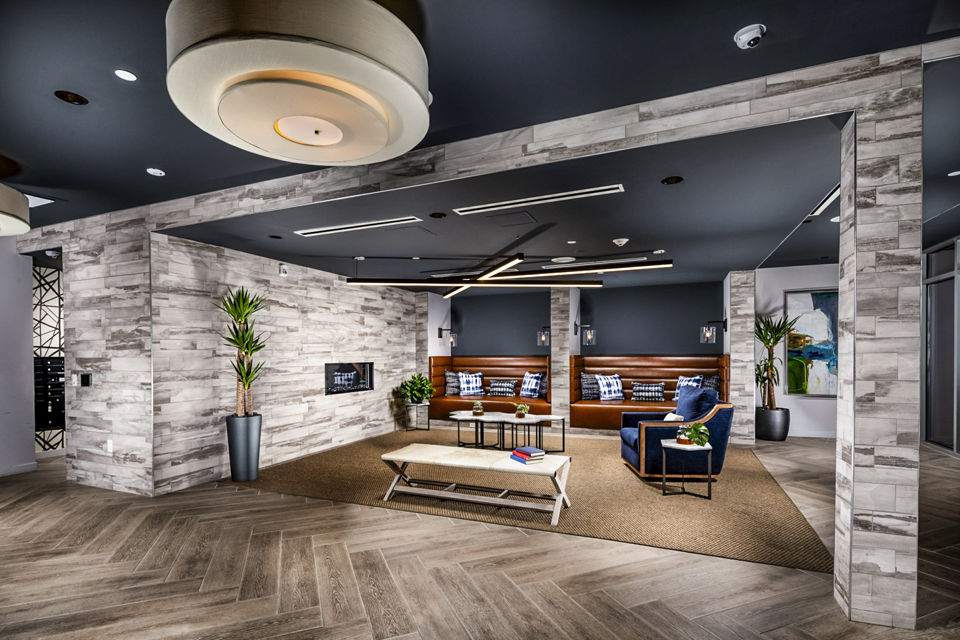 Clubhouse lounge with modern decor and seating area in Burano Apartments