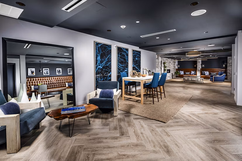 Clubhouse lounge with modern decor and seating in Burano Apartments