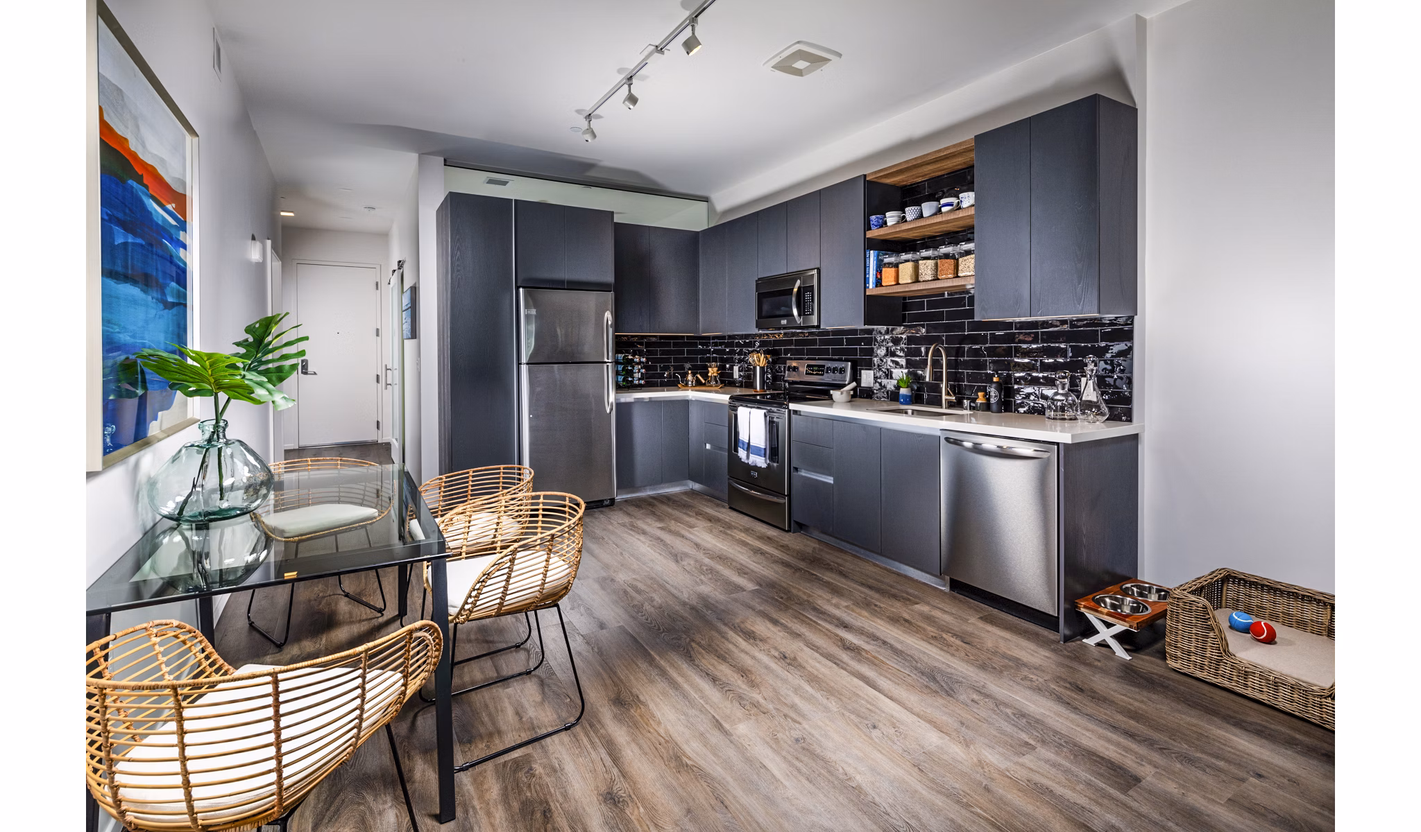 Modern kitchen with sleek countertops and stainless steel appliances at Burano Apartments