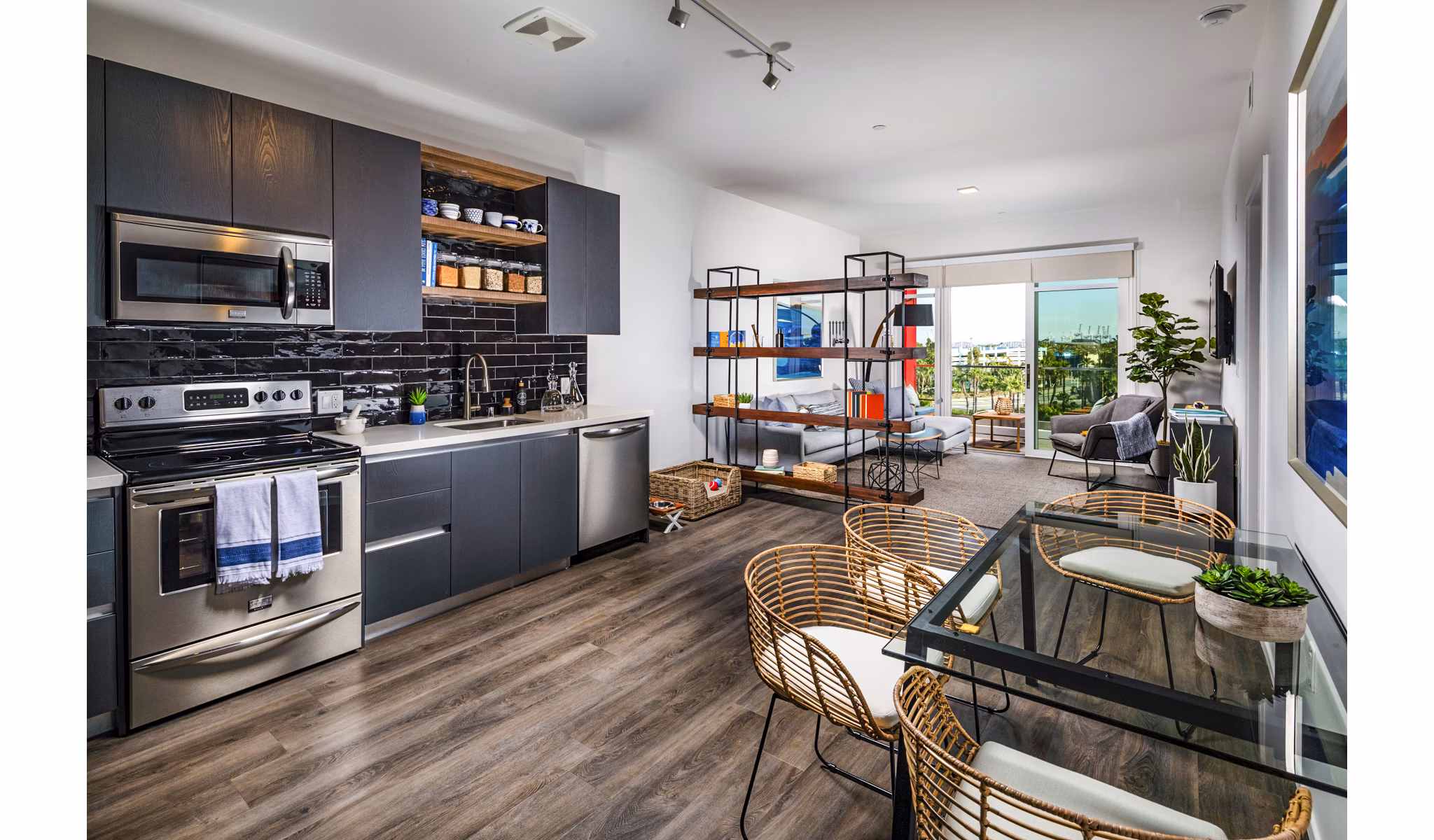Modern kitchen with sleek appliances and granite countertops in Burano Apartments