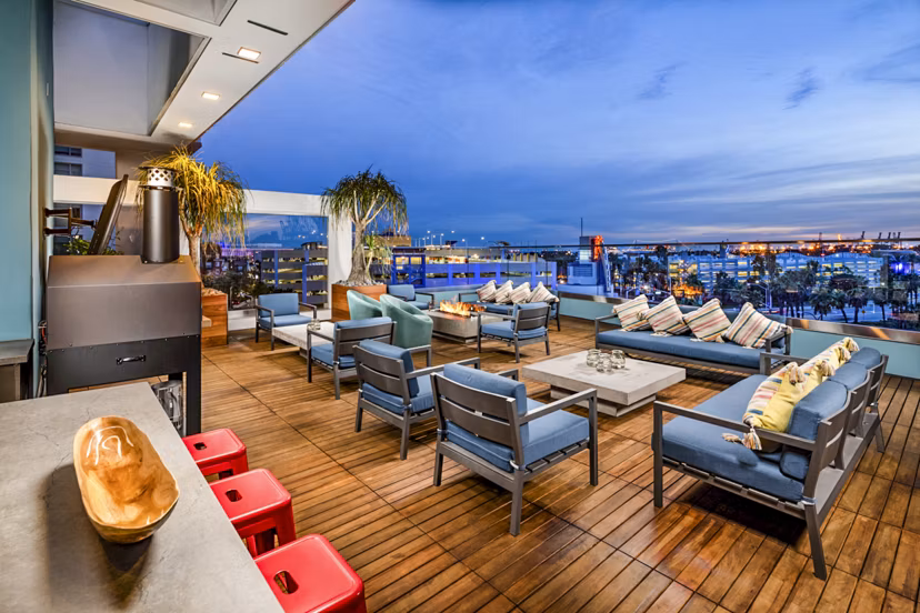 Fire pit with cozy seating on patio at Burano Apartments