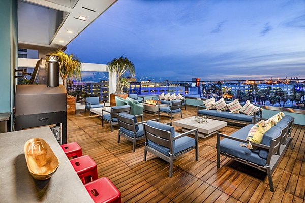 Fire pit with cozy seating on patio at Burano Apartments