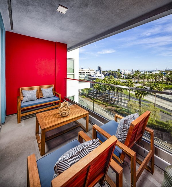 Scenic view from balcony at Burano Apartments showcasing stylish outdoor seating and cityscape, ideal for luxury living