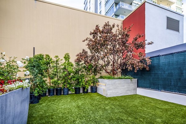 Pet-friendly dog park with agility equipment at Burano Apartments, a Greystar luxury community