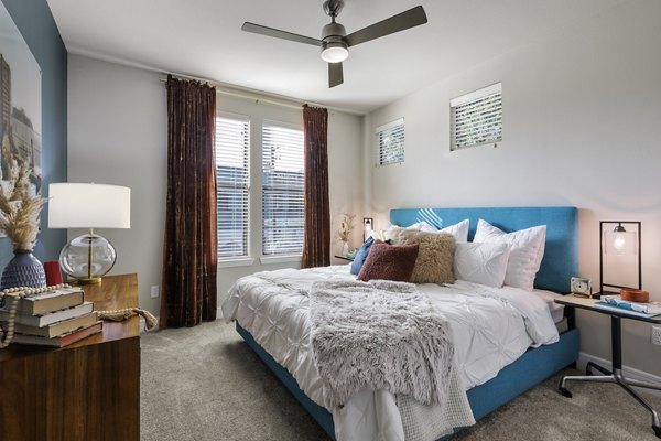 Modern bedroom with stylish decor at The Arnold Apartments