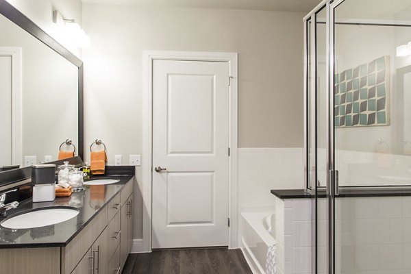 Modern bathroom featuring sleek fixtures at The Arnold Apartments