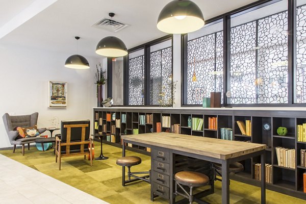 Clubhouse with modern design and seating area at The Arnold Apartments, a luxury Greystar community