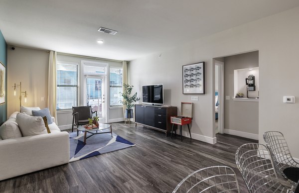 Spacious kitchen with modern stainless steel appliances in The Arnold Apartments