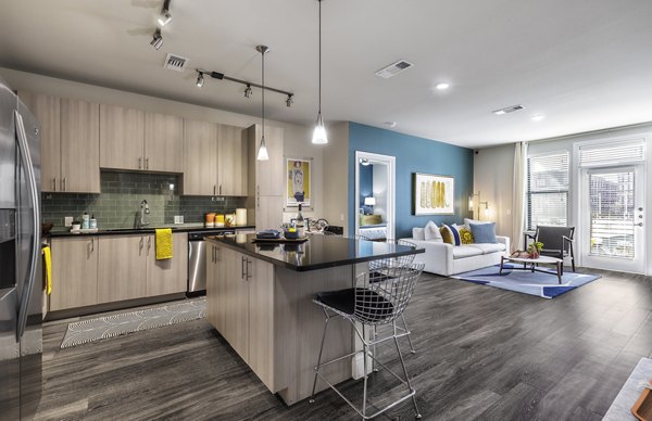 Spacious kitchen with stainless steel appliances at The Arnold Apartments