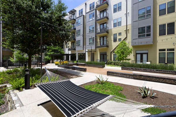 Tranquil courtyard with lush gardens at The Arnold Apartments