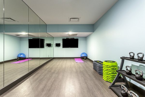Modern yoga and spin studio at Venue on 16th Apartments offering state-of-the-art fitness equipment for residents