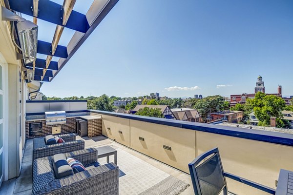 Grill and patio area with seating at Venue on 16th Apartments, ideal for outdoor gatherings and relaxation