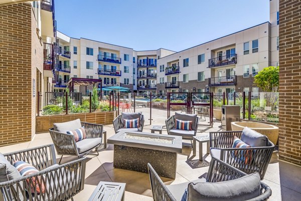 Cozy fire pit seating area at Venue on 16th Apartments