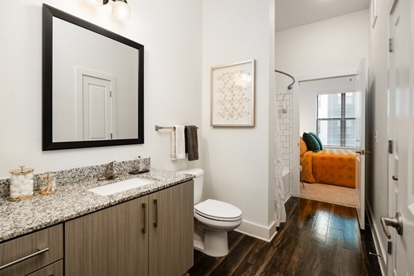 Elegant bathroom with modern fixtures at The Oliver Apartments