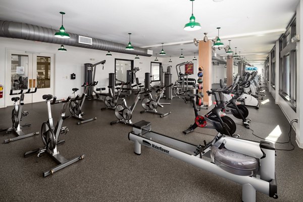 State-of-the-art fitness center with cardio machines at The Oliver Apartments