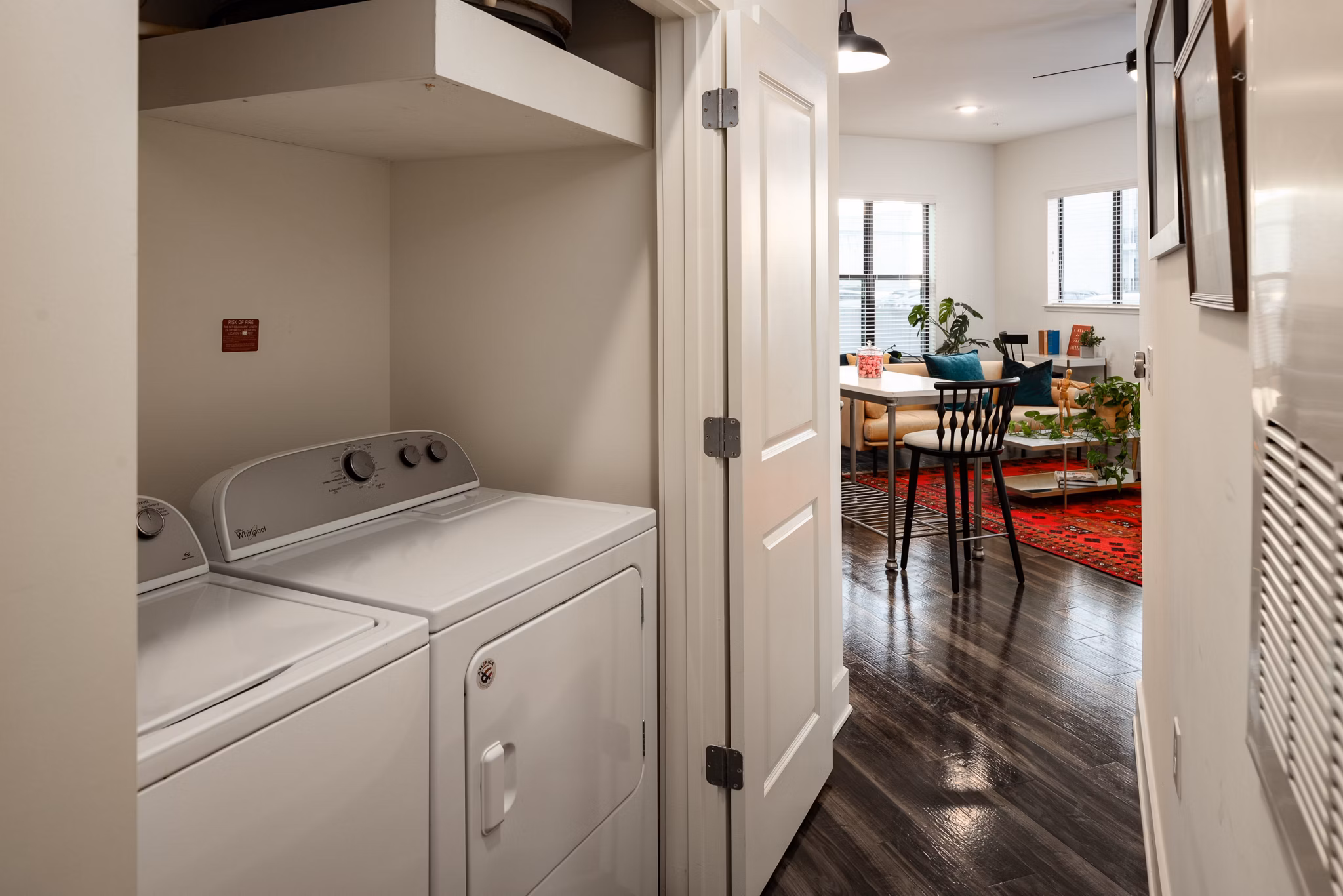 Laundry room with modern appliances at The Oliver Apartments