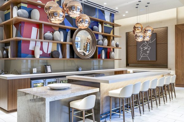 Clubhouse lobby featuring modern decor and seating at Flatiron Domain Apartments