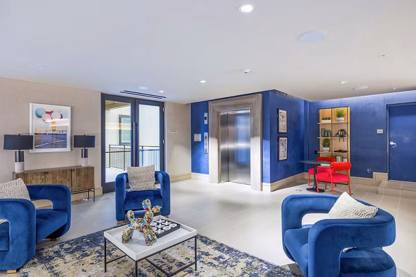 Spacious clubhouse lobby with modern seating and decor at Flatiron Domain Apartments, perfect for resident gatherings and community events