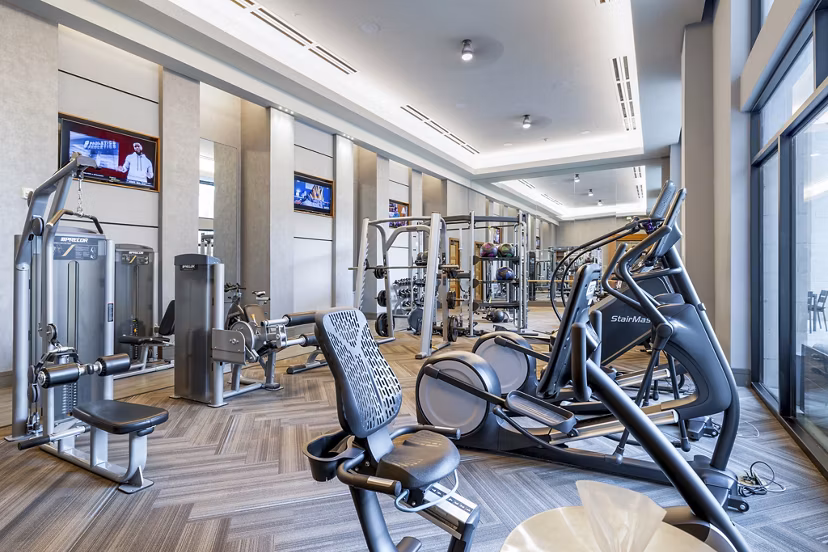 Spacious fitness center with modern equipment at Flatiron Domain Apartments