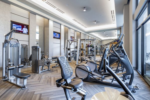 Spacious fitness center with modern equipment at Flatiron Domain Apartments