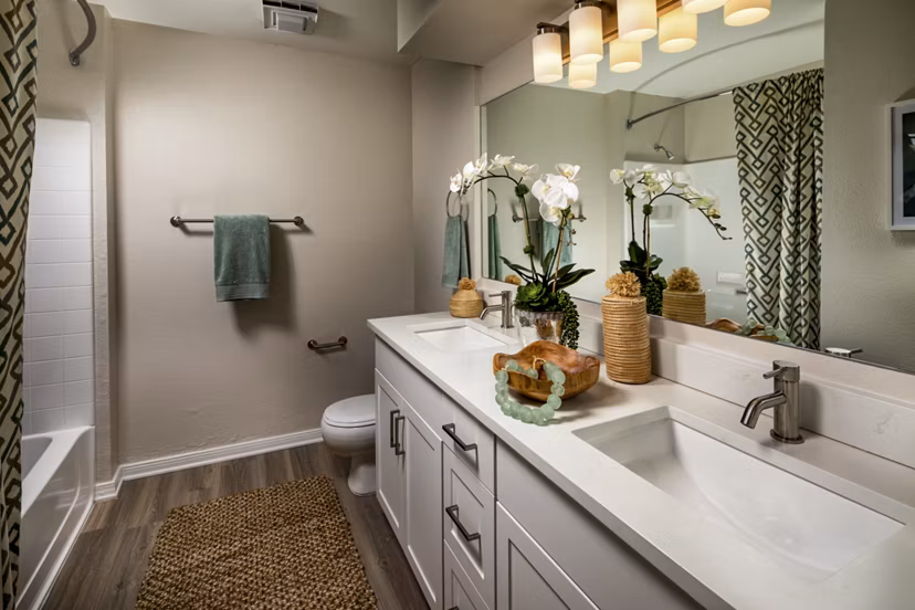 Luxurious bathroom with marble countertops and spacious vanity in Seacrest Apartment Homes, enhancing modern living