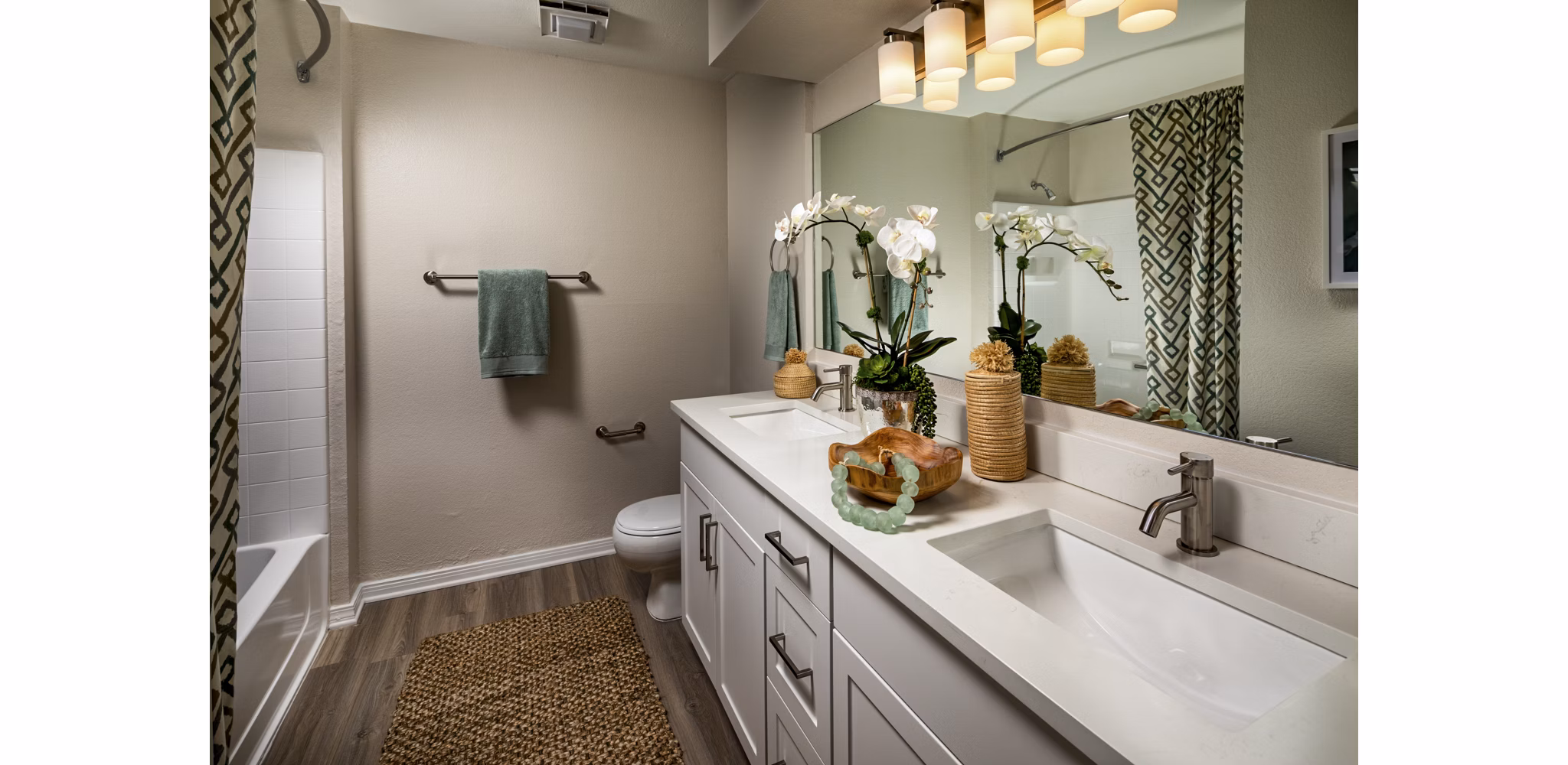 Luxurious bathroom with marble countertops and spacious vanity in Seacrest Apartment Homes, enhancing modern living