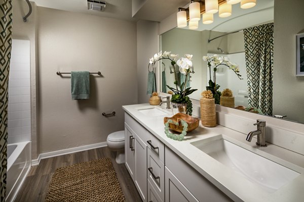 Luxurious bathroom with marble countertops and spacious vanity in Seacrest Apartment Homes, enhancing modern living