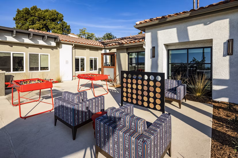Vibrant game area featuring pool table and seating at Seacrest Apartment Homes in a welcoming community setting
