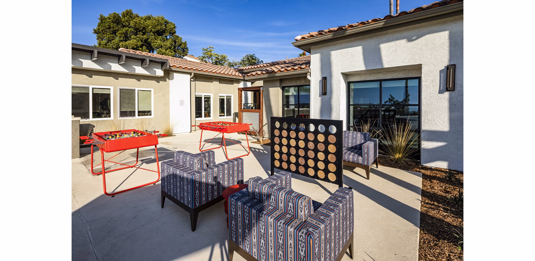 Vibrant game area featuring pool table and seating at Seacrest Apartment Homes in a welcoming community setting
