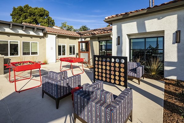 Vibrant game area featuring pool table and seating at Seacrest Apartment Homes in a welcoming community setting