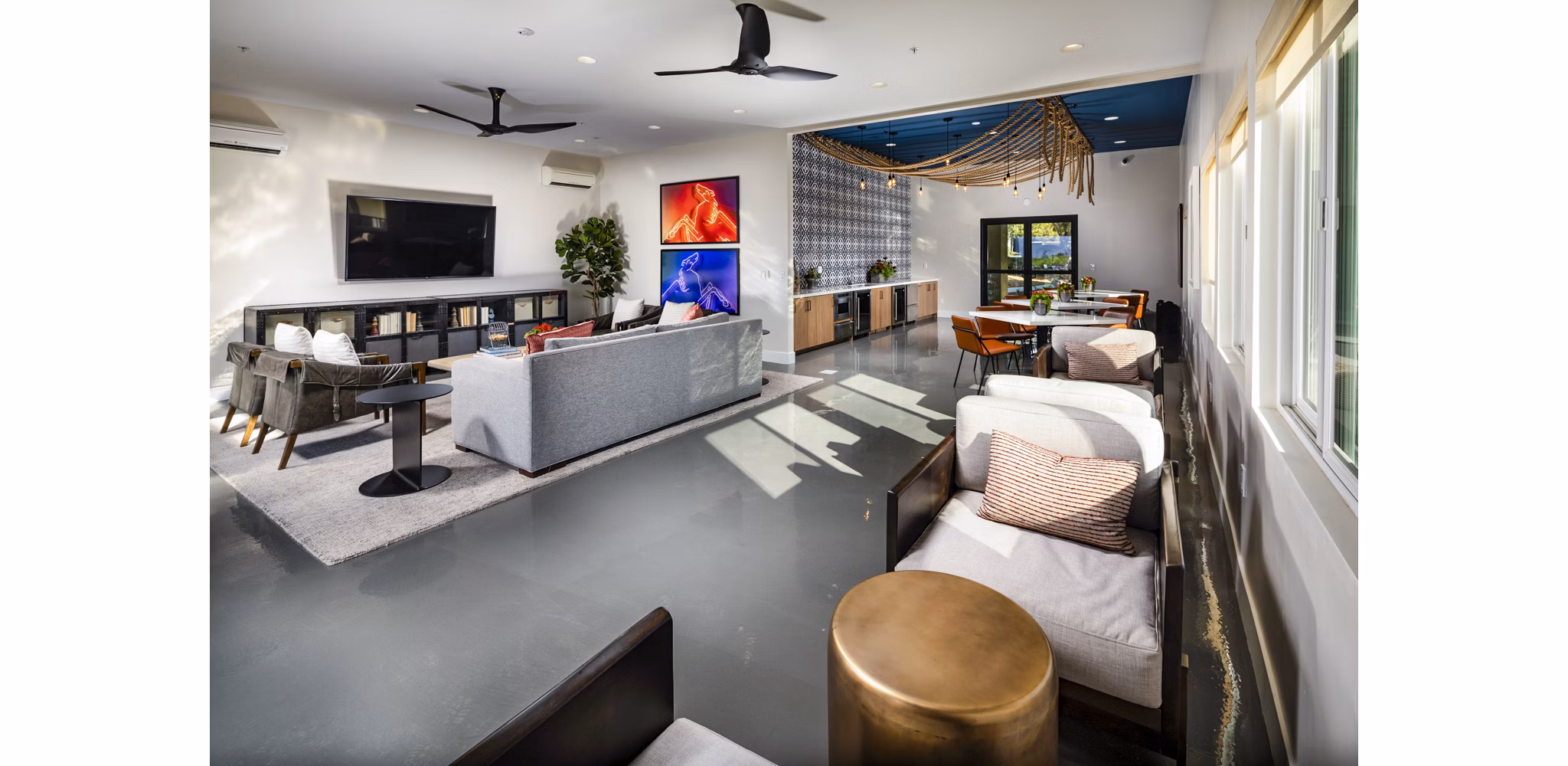 Modern clubhouse lobby with sleek decor and comfortable seating at Seacrest Apartment Homes in this luxury Greystar community image