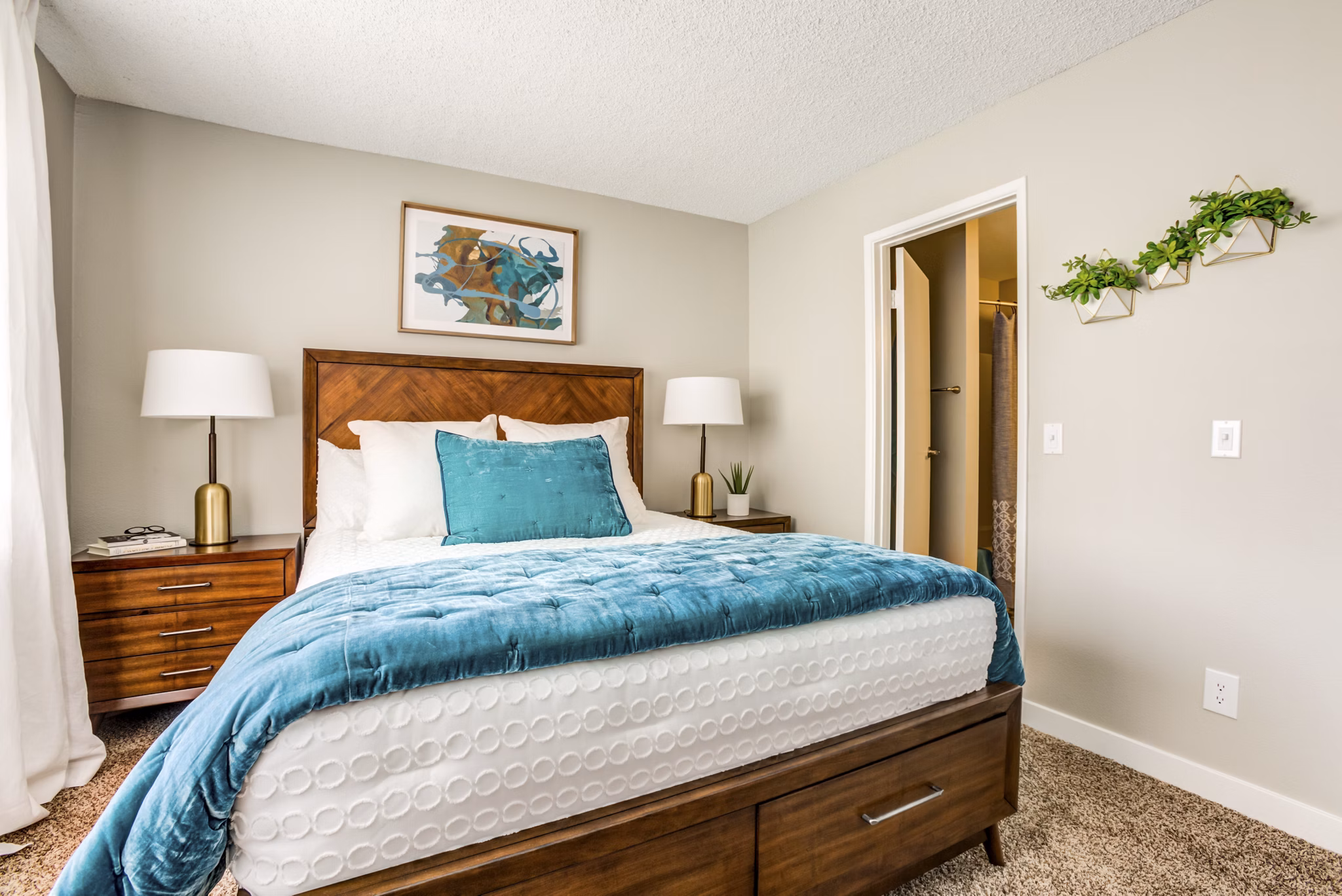 Cozy bedroom with modern decor at Avana Chandler Apartments, offering luxurious living spaces by Greystar