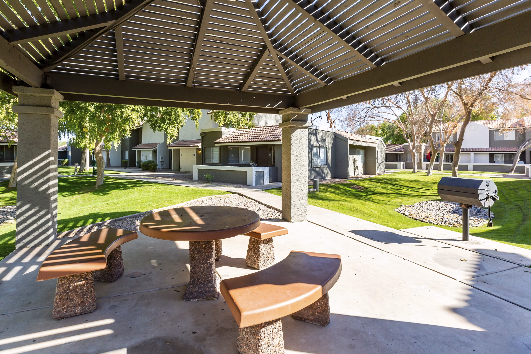 Inviting grill area with modern cooking stations at Avana Chandler Apartments, perfect for outdoor dining and social gatherings